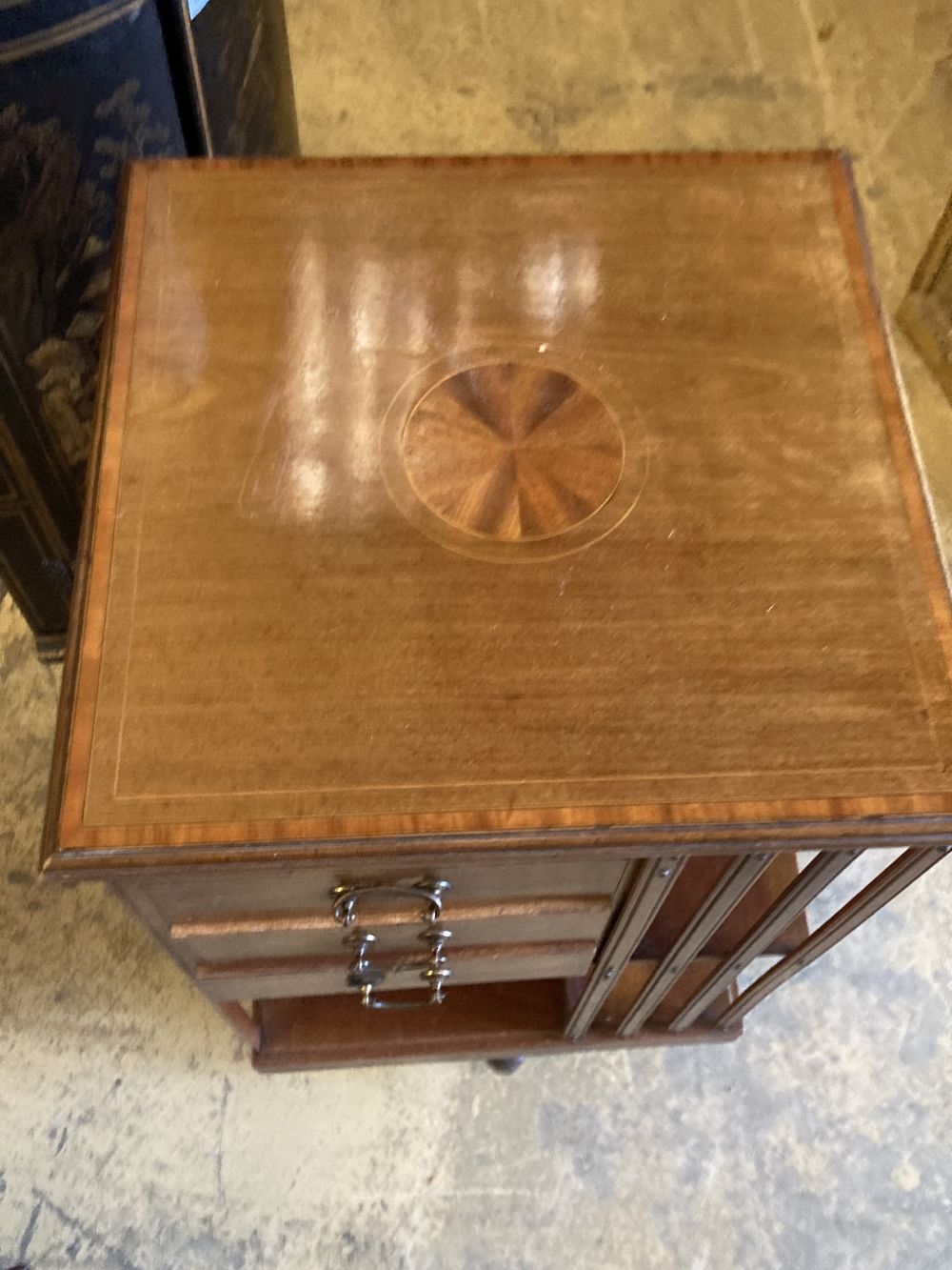 An Edwardian satinwood banded mahogany revolving bookcase, fitted drawers, width 48cm, depth 48cm, height 88cm